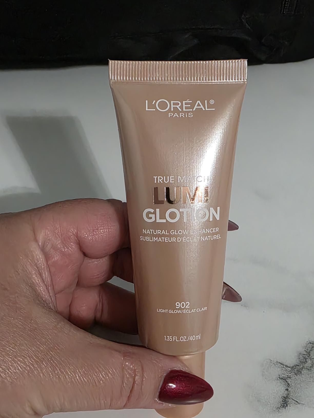 L'Oreal Paris Makeup True Match Lumi Glotion, Natural Glow Enhancer, Illuminator Highlighter, Bronzing Drops For a Sun-Kissed Glow For Face and Body, 902 Light, 1.35 fl oz customer photo 1